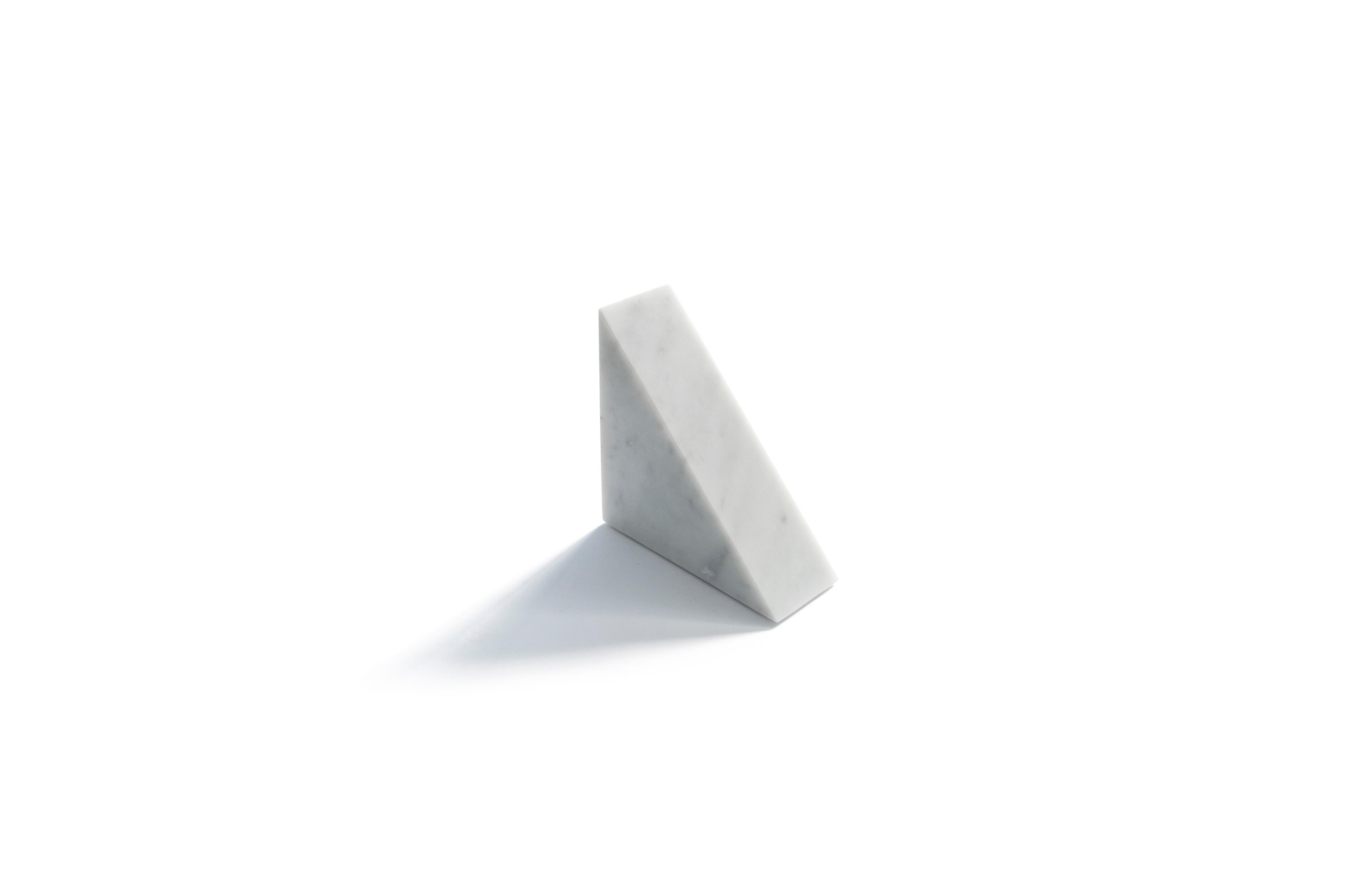 Big bookend or decorative object in satin white Carrara marble with triangular shape. Each piece is in a way unique (every marble block is different in veins and shades) and handmade by Italian artisans specialized over generations in processing