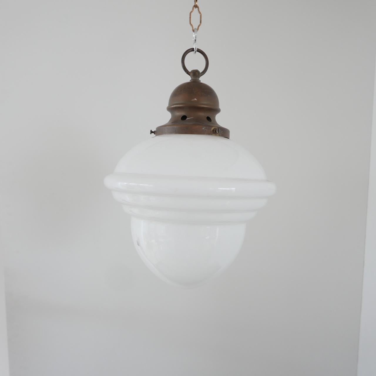 A single opaline pendant.

Early to mid-20th century.

Stepped glass, almost acorn shaped.

Brass gallery. No chain but we can provide if needed.

Dimensions: 43 height x 28 diameter in cm.