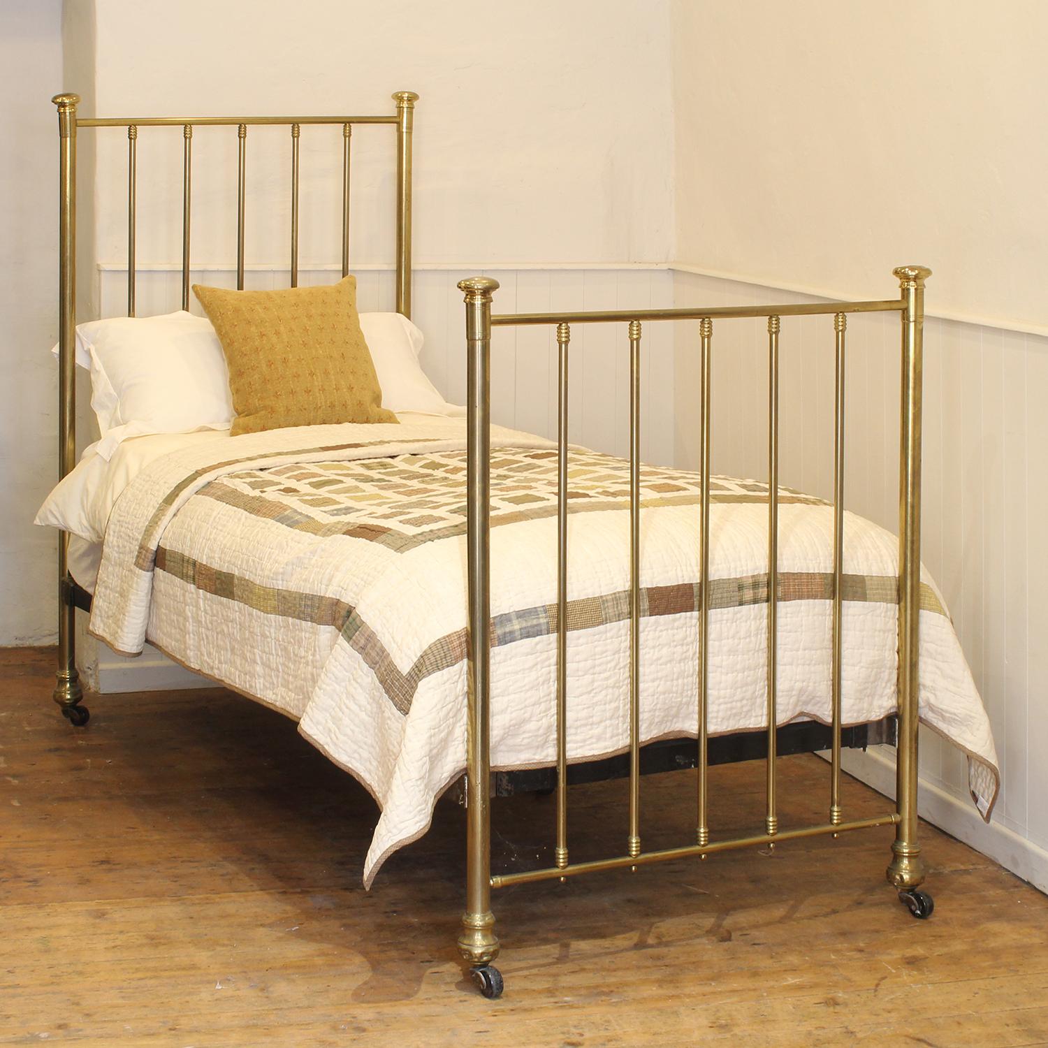 A simple brass and iron Edwardian single bed with fine patina and brass caps.
This bed takes a standard UK single 3ft wide x 6ft 3in long base and mattress, but will take a US twin 38 inch wide base and mattress with a slight overlap.
The price