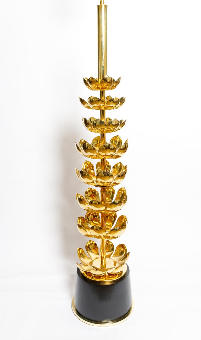 Single brass lotus form floor lamp with black base, by Feldman.