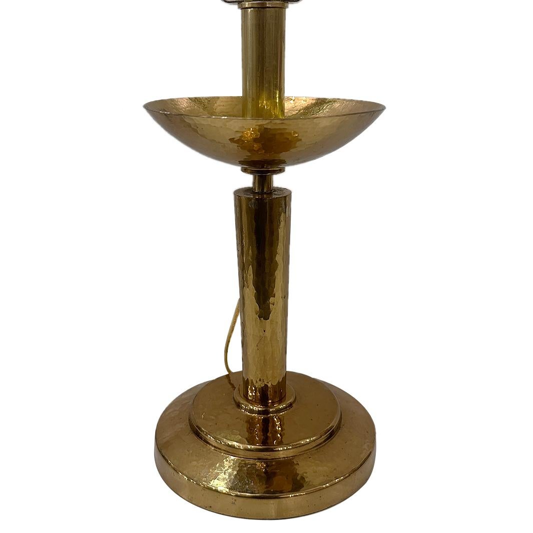 An Italian circa 1960's hammered brass table lamp.

Measurements:
Height of body: 12