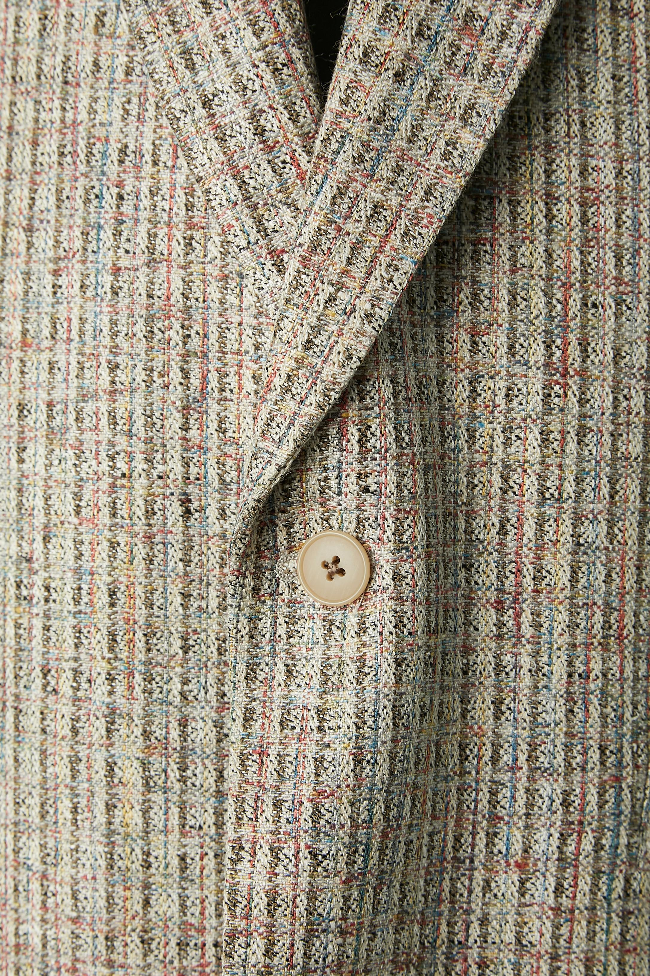 Single breasted cotton Jacket. No fabric composition tag but the branded lining is probably rayon. The lining is everywhere inside the jacket except on the half bottom of the back. 
Shoulder pad. One button and buttonhole closure on the middle front