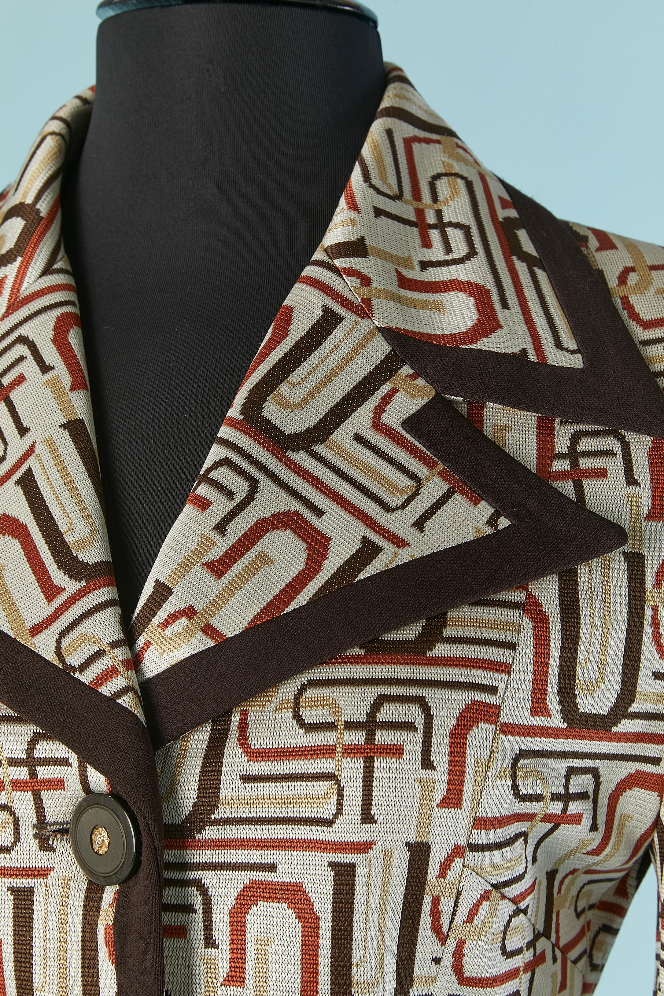 Single breasted jacket with letter jacquard pattern. Shell fabric composition: 86% rayon, 14% cupro. Lining composition: 100% rayon. 
Shoulder pad. Branded 