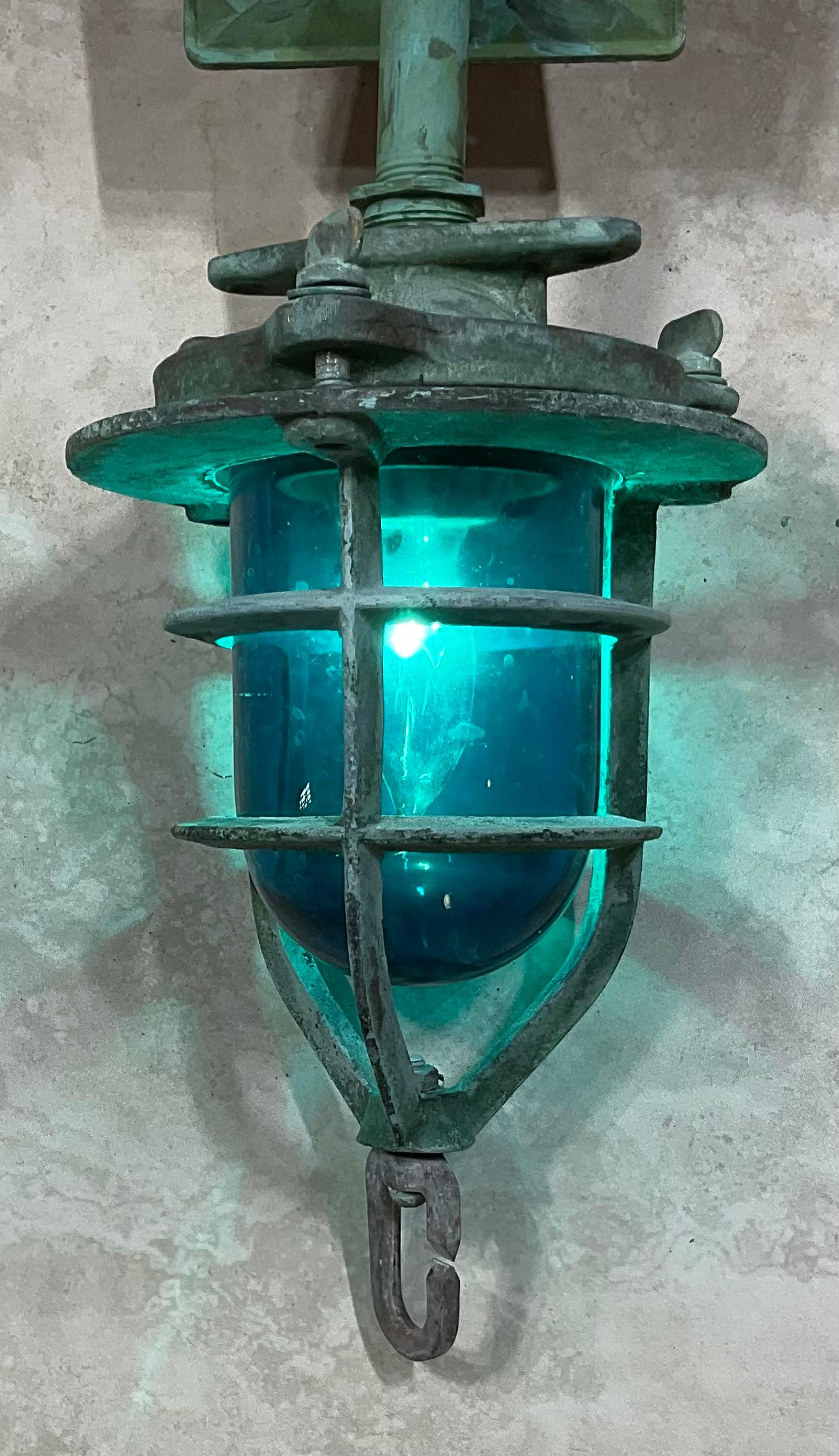 
Original marine convoy light from a ship , with blue glass light and protective original solid bronze cage . Porcelain socket for one 60/watt light.
Steel Backplate size 5” x3”