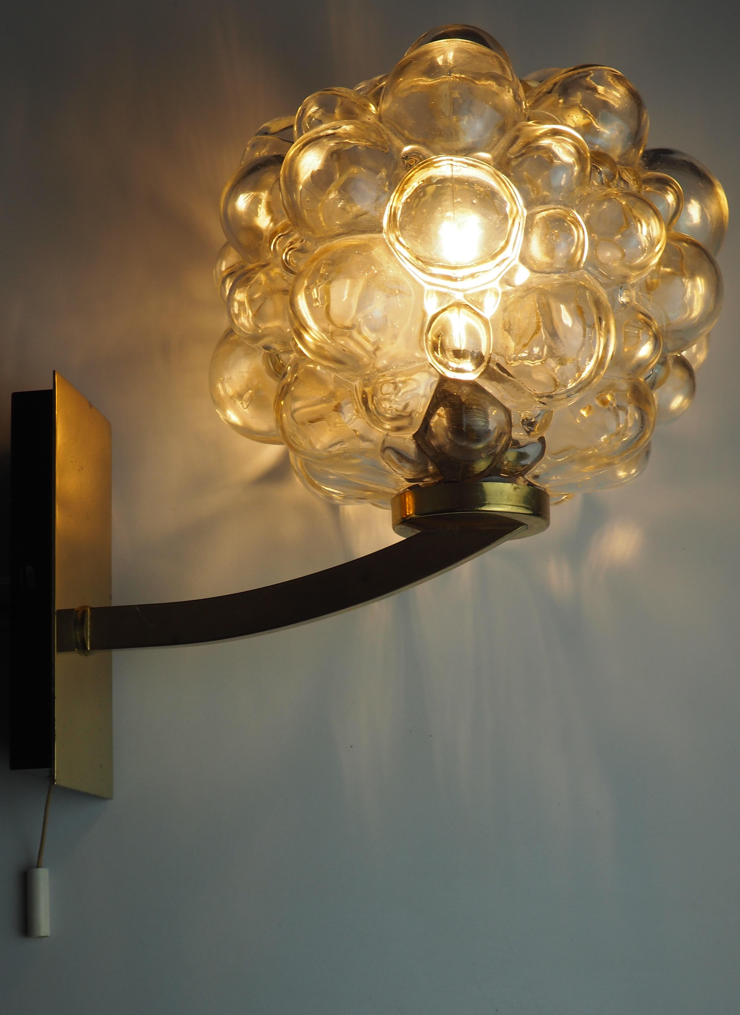 A great wall light by Helena Tynell for Limburg, Germany, 1960s.
Thick amber bubbled glass shade for 1 x e14 lamp socket.
Very good condition.