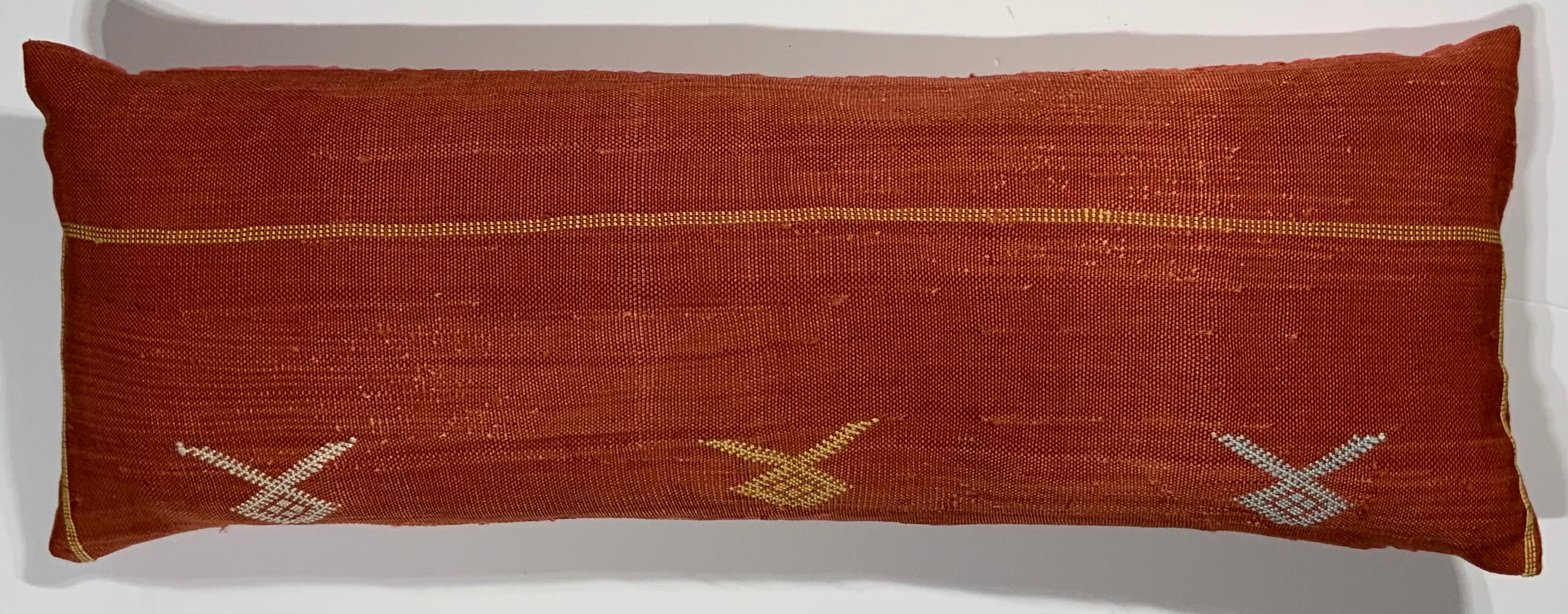 Beautiful pillow made of handwoven flat-weave textile with multi colors geometric motif on a red background, fine silk backing, fresh new down and feather insert.
