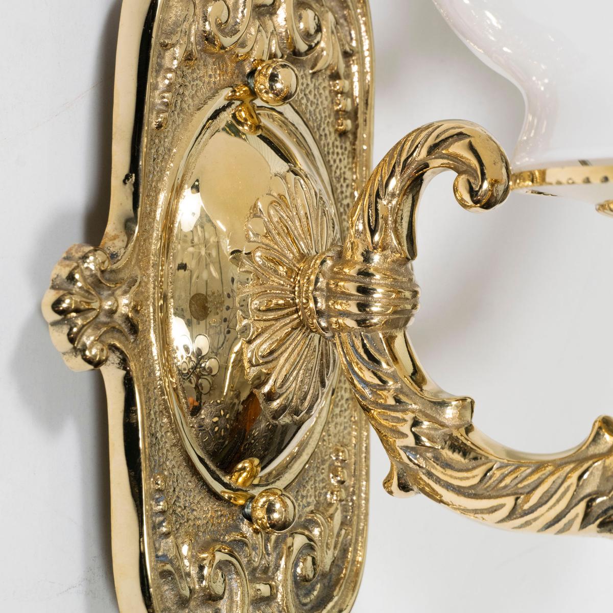 Italian Single cast brass sconce with globe shade For Sale