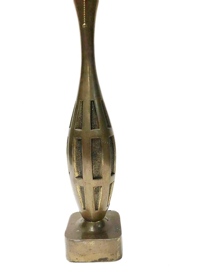 A tall single circa 1940's French cast bronze table lamp with architectural motif.

Measurements:
Height of body 22”
Widest point: 5”