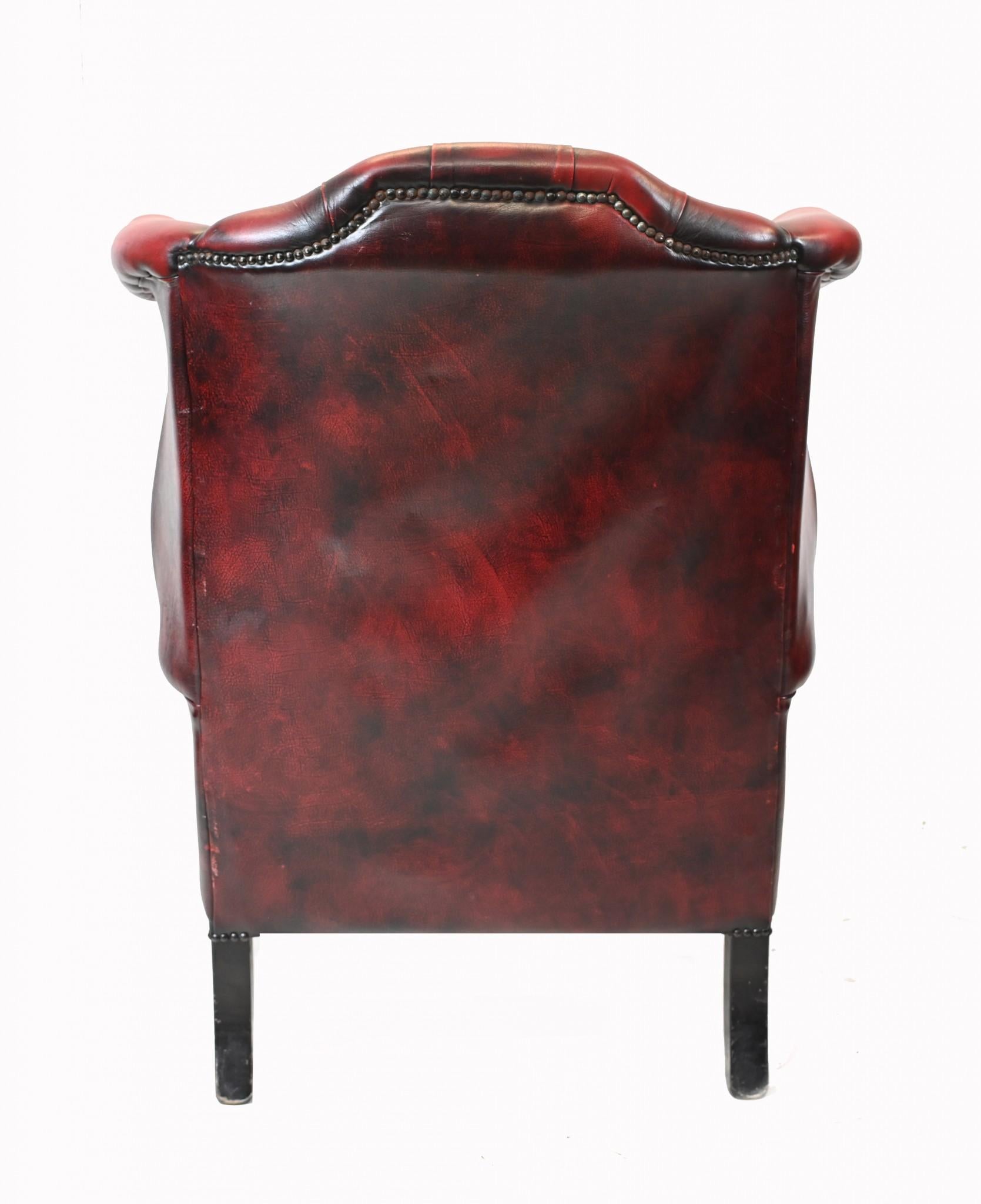 Elegant single leather Chesterfield wingback arm chair
Classic deep button finish to the back 
Very comfortable to sit in, you can really sink back into these
Red leather with antiqued finish
Bought from a dealer on Church Street London NW8
Some of