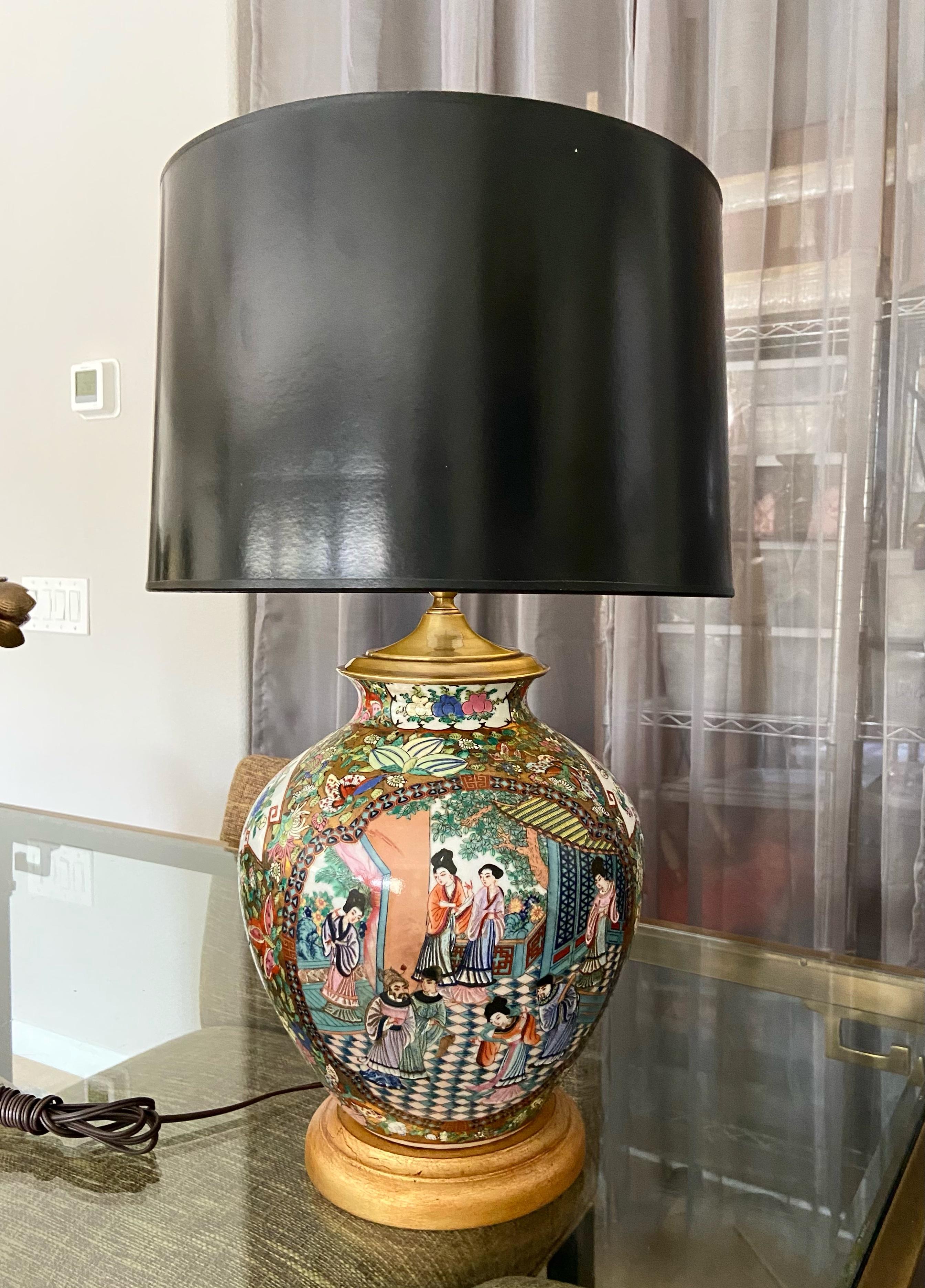 Single Chinese porcelain Famille rose vase mounted as table lamp giltwood turned base. Beautifully crafted with bright painted images throughout including Emperors court scene, butterfles and flower. Newly wired including new 3-way socket. Harp and