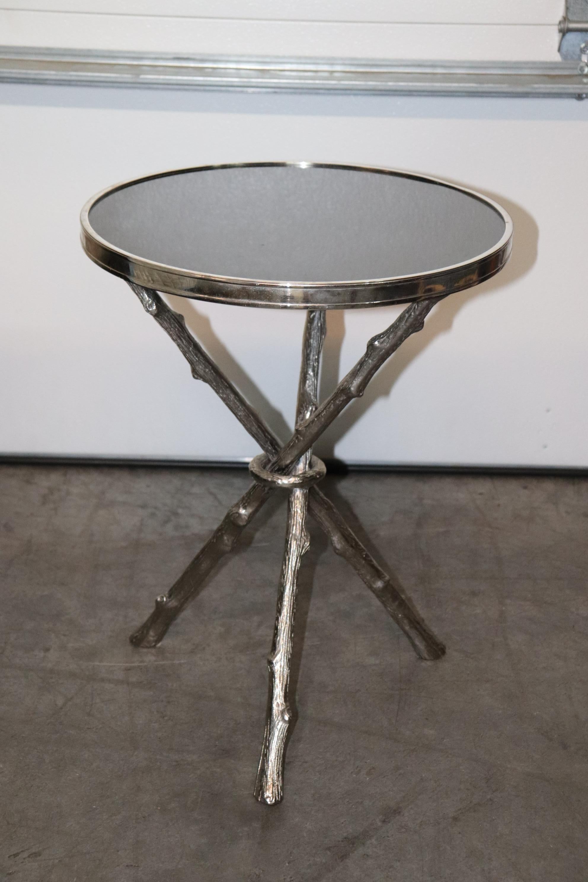 This is a superb chrome plated brass table in the style of Bagues in Faux Bois. The top is made of black granite and the table is in good condition. The table measures 14 x 14 wide x 23 tall. Dates to the 1990s or later. 