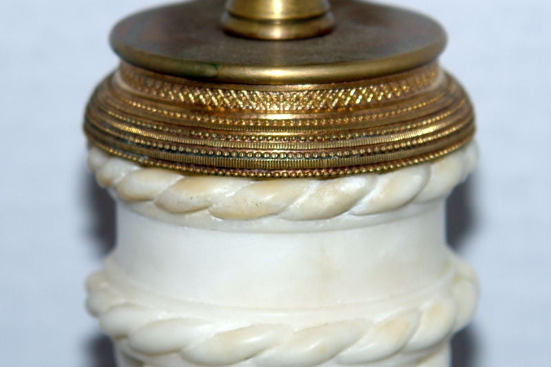 A circa 1920s Italian carved alabaster table lamp with twisted column design.

Measurements:
Height of body: 19