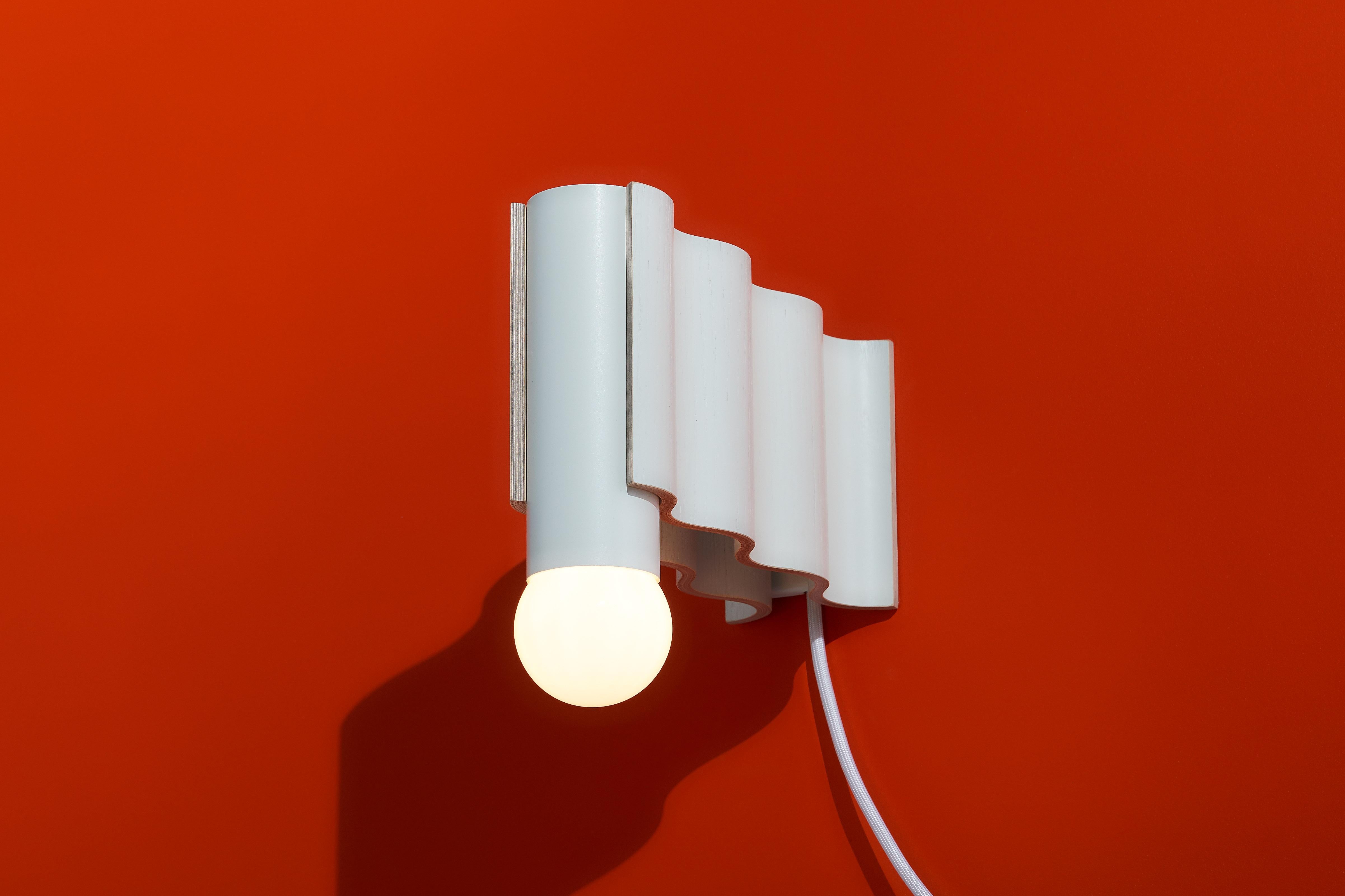 Single sconce made from off-white painted ash veneered plywood and off-white powder-coated aluminium tube.

Technical information:
- Comes with dimmable bulb (Class A60, 8W, 720 Lumen, 3000° Kelvin, A+ energy rating, Ra > 80)
- Can be wired for a