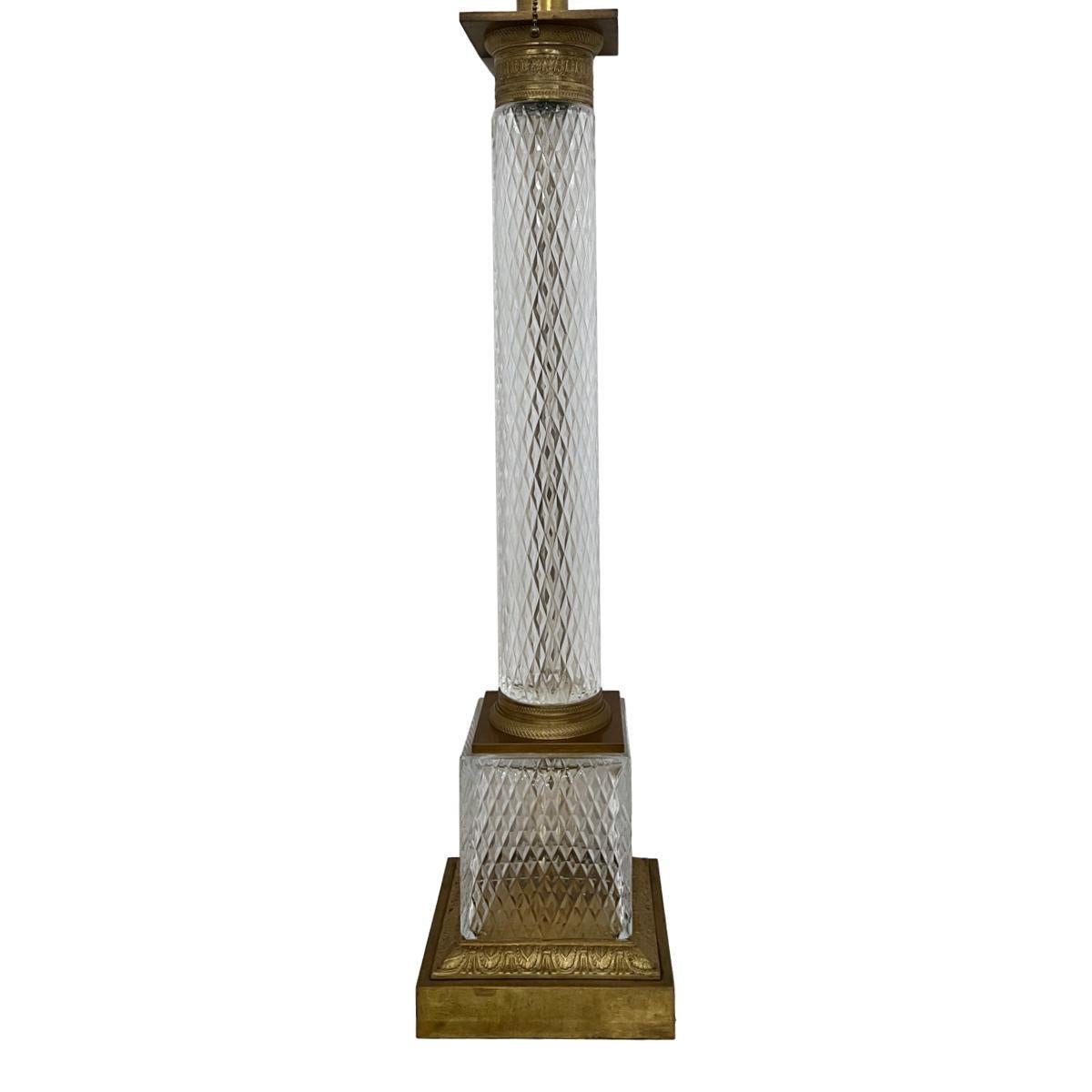A single French circa 1940's cut glass column table lamp with gilt bronze base.

Measurements:
Height of body: 29