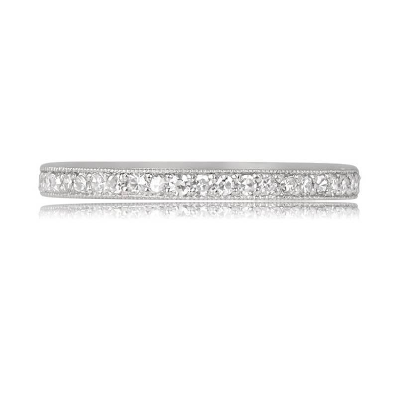 A stunning eternity band crafted in platinum, featuring exquisite hand engravings and delicate fine milgrain details. The band is elegantly pave-set with single-cut diamonds, adding a touch of brilliance and sophistication.

Ring Size: 6.5 US,