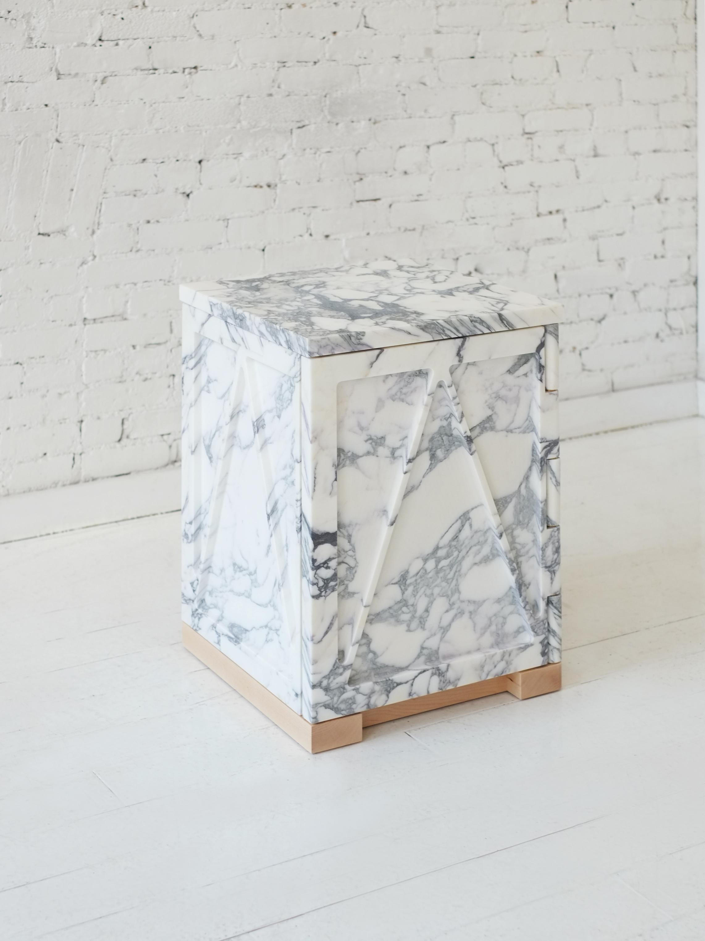 A part of Fort Standard’s collection, “Qualities of Material”, this single door stone cabinet has a triangular relief pattern milled into the exterior panels, which removes excess weight and allows the remaining ribs to retain the material’s