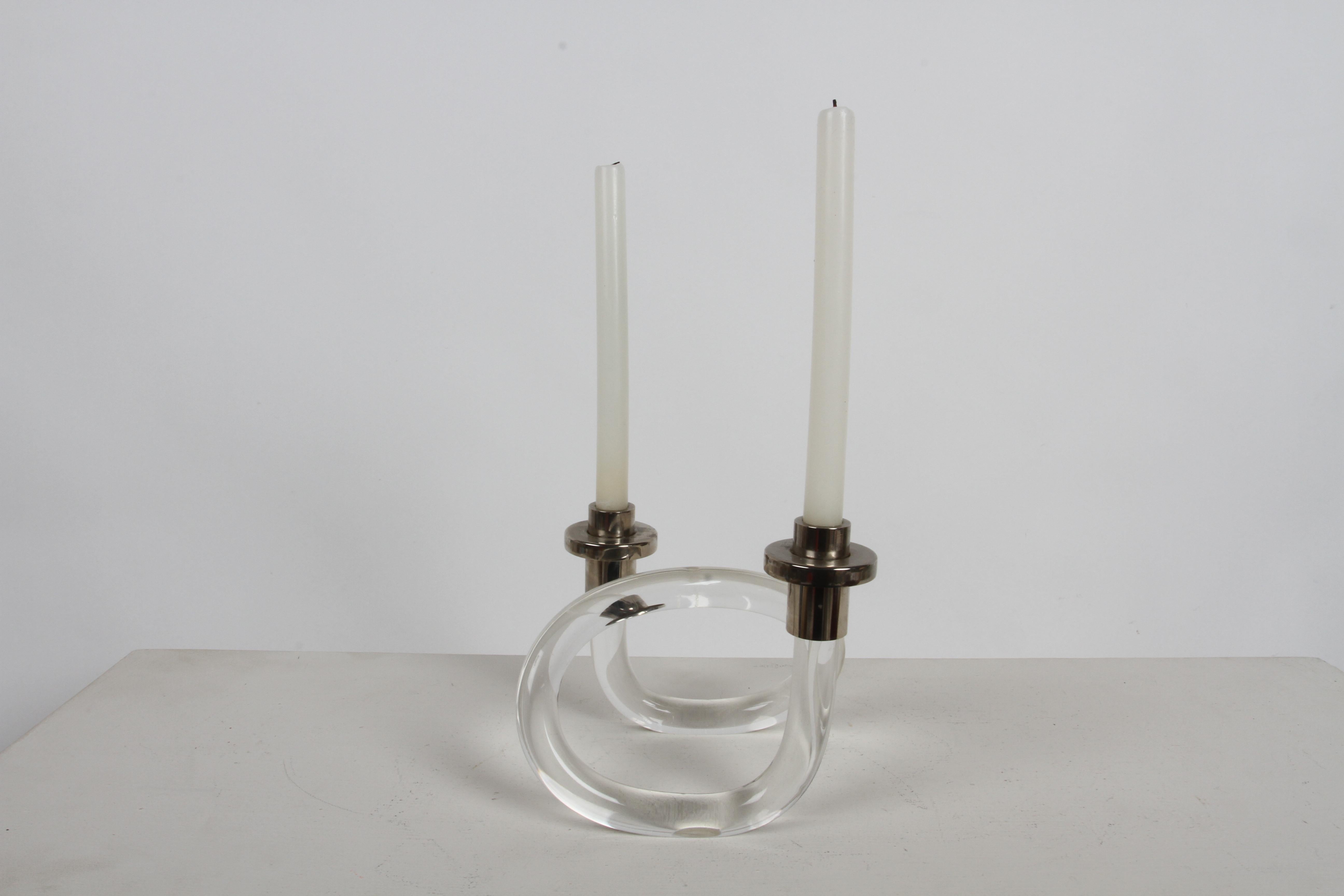 Classic Dorothy Thorpe twisted Lucite candlestick with nickel plated candle holders. Set does show very few internal age cracks, common with lucite of this age. Excludes candles. 