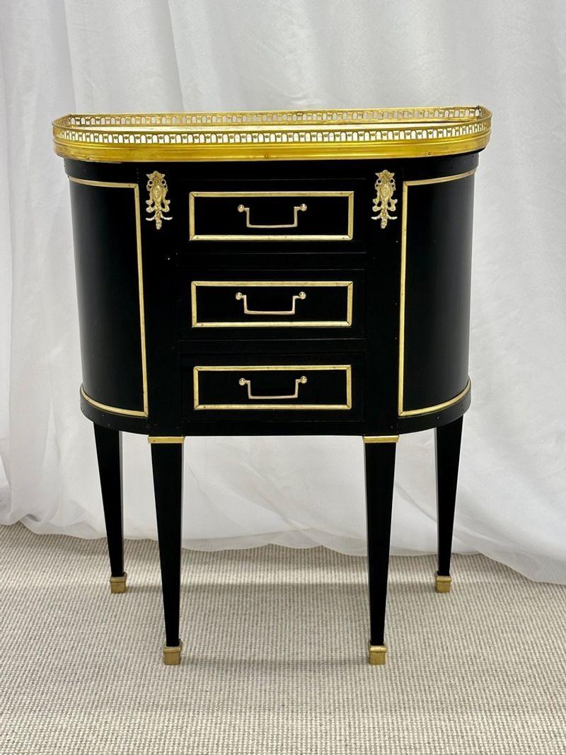 A Maison Jansen Hollywood Regency style table, Demi Lune, Marble Top, Bronze Mounted
A finely detailed custom quality end or side table for Livingroom or as Bedside tables. Fully refinished in ebony with bronze mounts. This Three drawer bronze