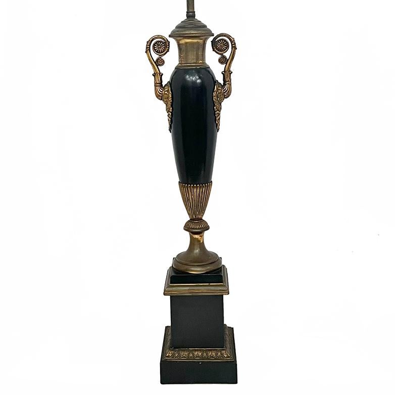 A Turn of the Century French Empire style table lamp with painted finish.

Measurements:
Height of body: 23