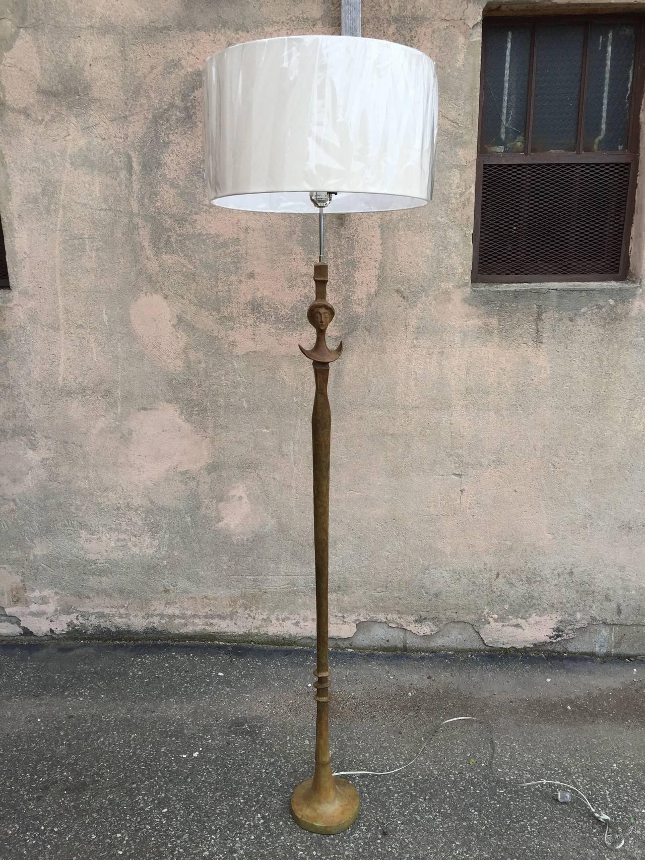 Single sculptural bronze lamp after Giacometti, with green finished paint.