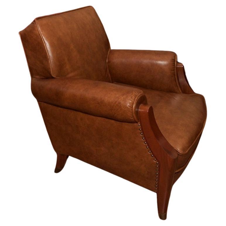 Elegant French Art Déco Club Chair by Baptistin Spade. ( 1891-1961 ).
The Club Chair has been reupholstered in antique leather, the wooden frame was restored and the brass sabots polished.
A photo is attached showing the armchair in its original