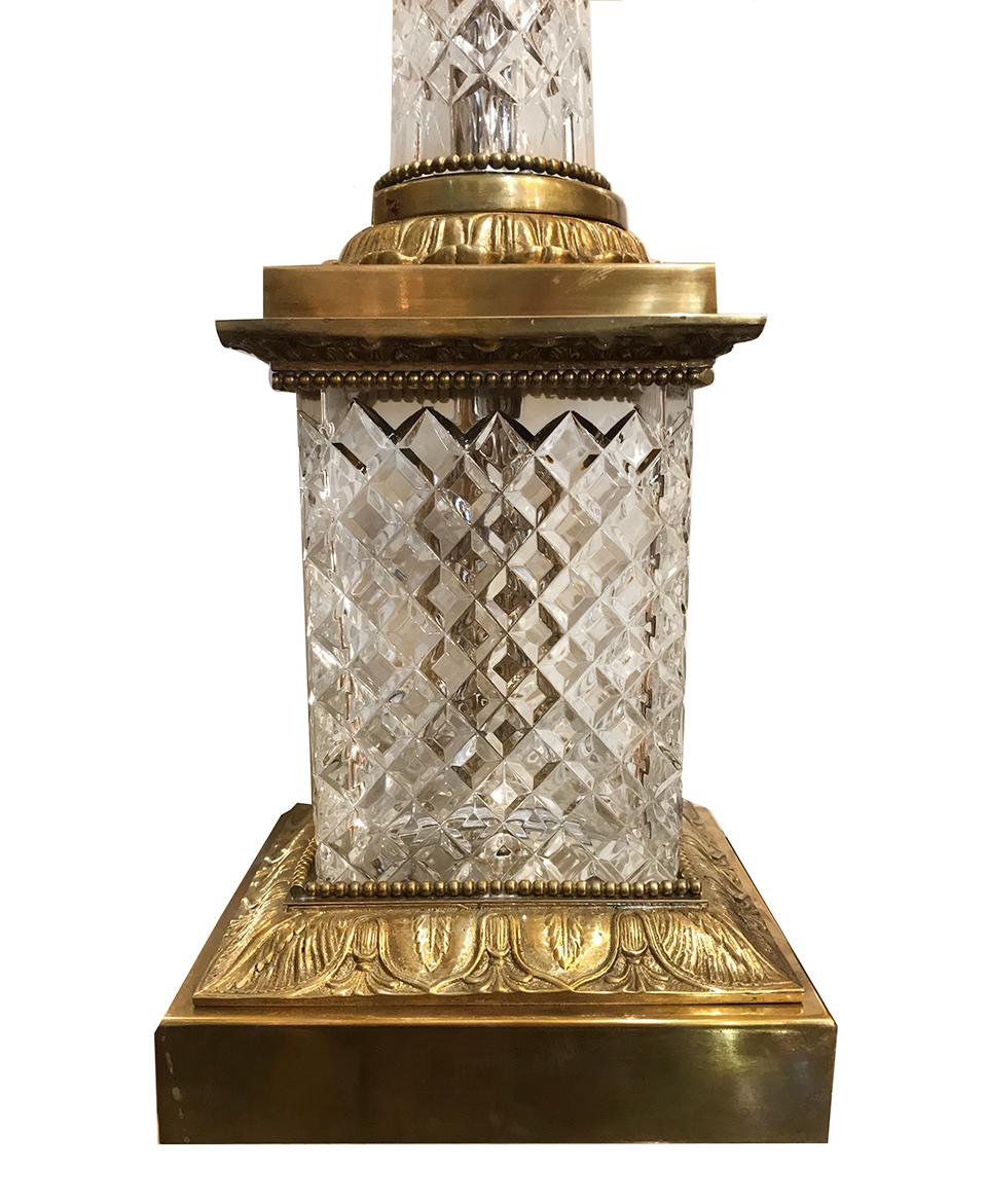 A single French circa 1930s cut crystal table lamp with gilt bronze details.

Measurements:
Height of body: 23.5