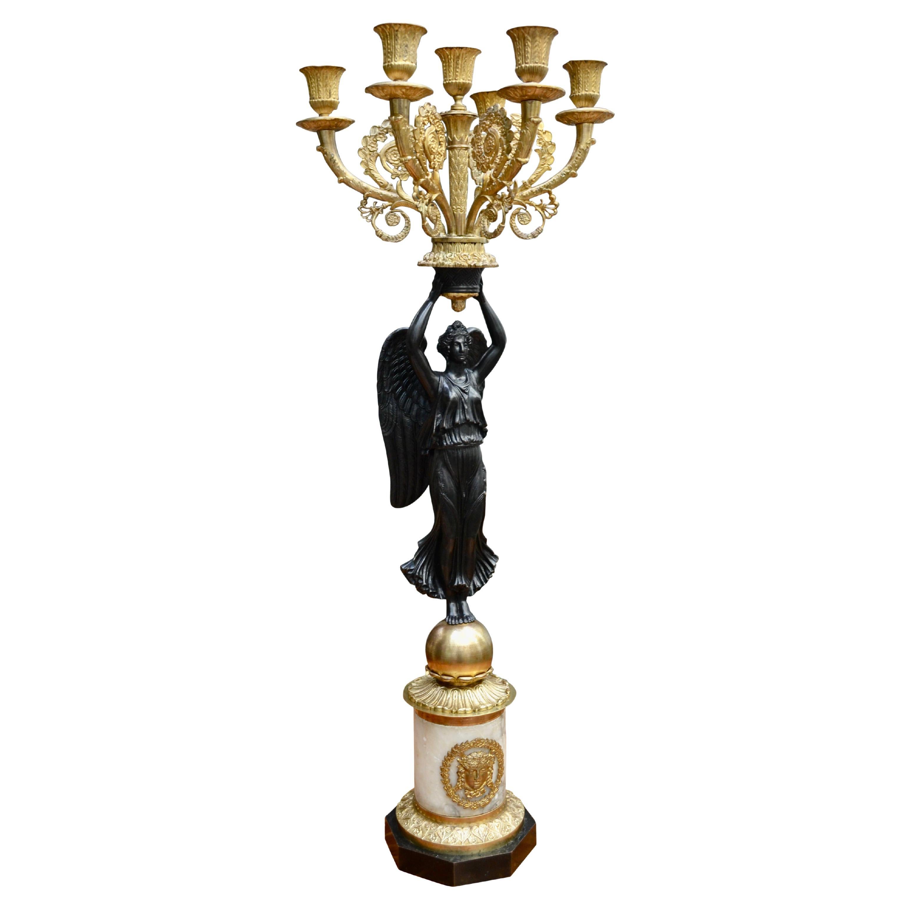 Single French Empire Style Patinated  and Gilt Bronze Winged Victory Candelabra
