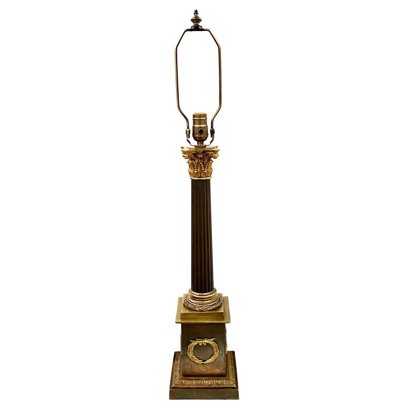 A circa 1920s French Empire-style table lamp with original patina.

Measurements:
Height of body 23.5