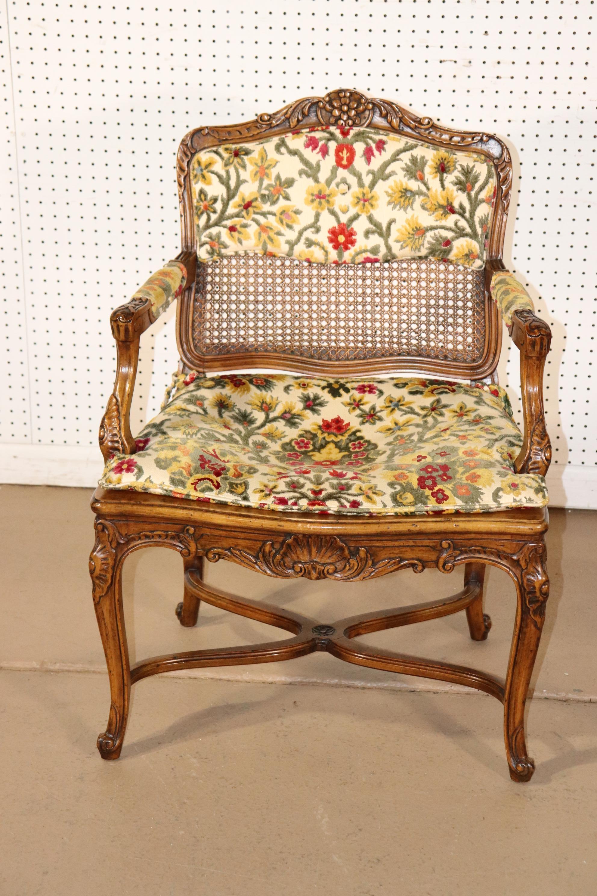 This chair features a cane seat and a cane back. The seat is pushed in and the cushion does work to hide that. But that's the way it is. The dimensions are 36 tall x 25 wide x 20 deep and the seat height is 18 inches with the cushion.