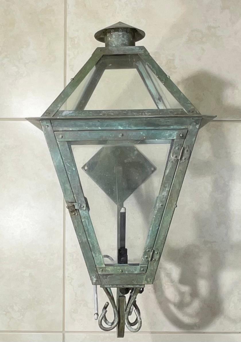 Single wall hanging gas lantern hand crafted of solid copper, the wall arm made of steel.
 