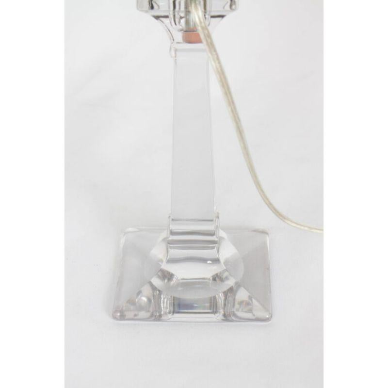 Transparent Glass Candlestick Lamp. Square base, and square stem. Custom lamp made from Early 20th Century glass

Material: Glass
Style: Traditional
Period made: Early 20th Century
Dimensions: 4 × 4 × 16 in
Condition Details: New Lamp with Antique