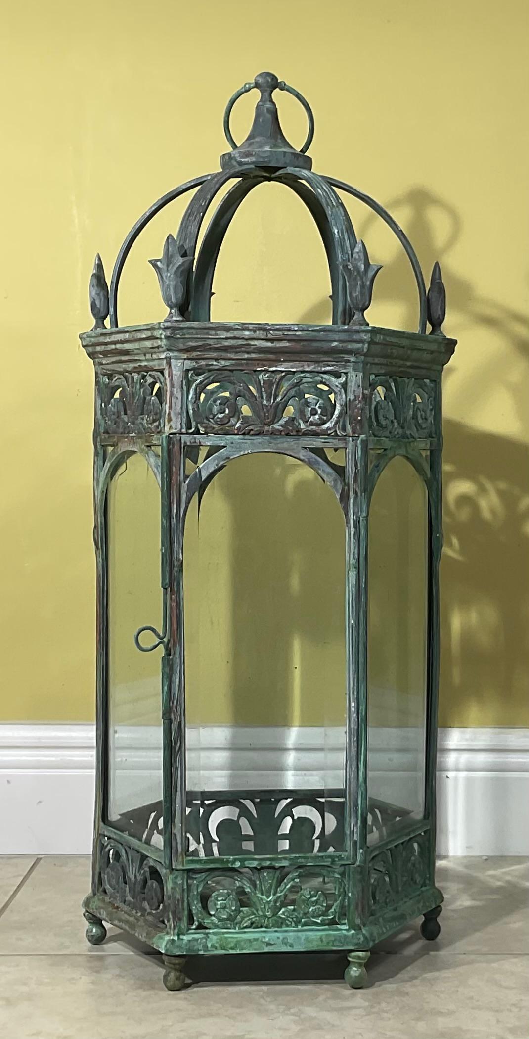 Beautiful of handcrafted lantern made of happy, solid bronze and brass exceptional quality and design workmanship, large space inside for three candles one door opening, bevelled glass all around and very decorative doom top. Nice greenish patina