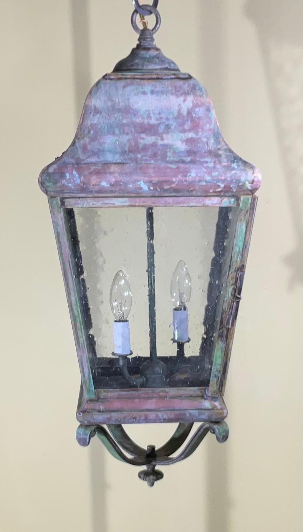 single hanging lantern made of solid brass, quality workmanship, electrified with two 60/watt lights . Seeded glass ,Nice patina great light exposure. Working and ready to use.
Suitable for wet locations.
Canopy and chain included.