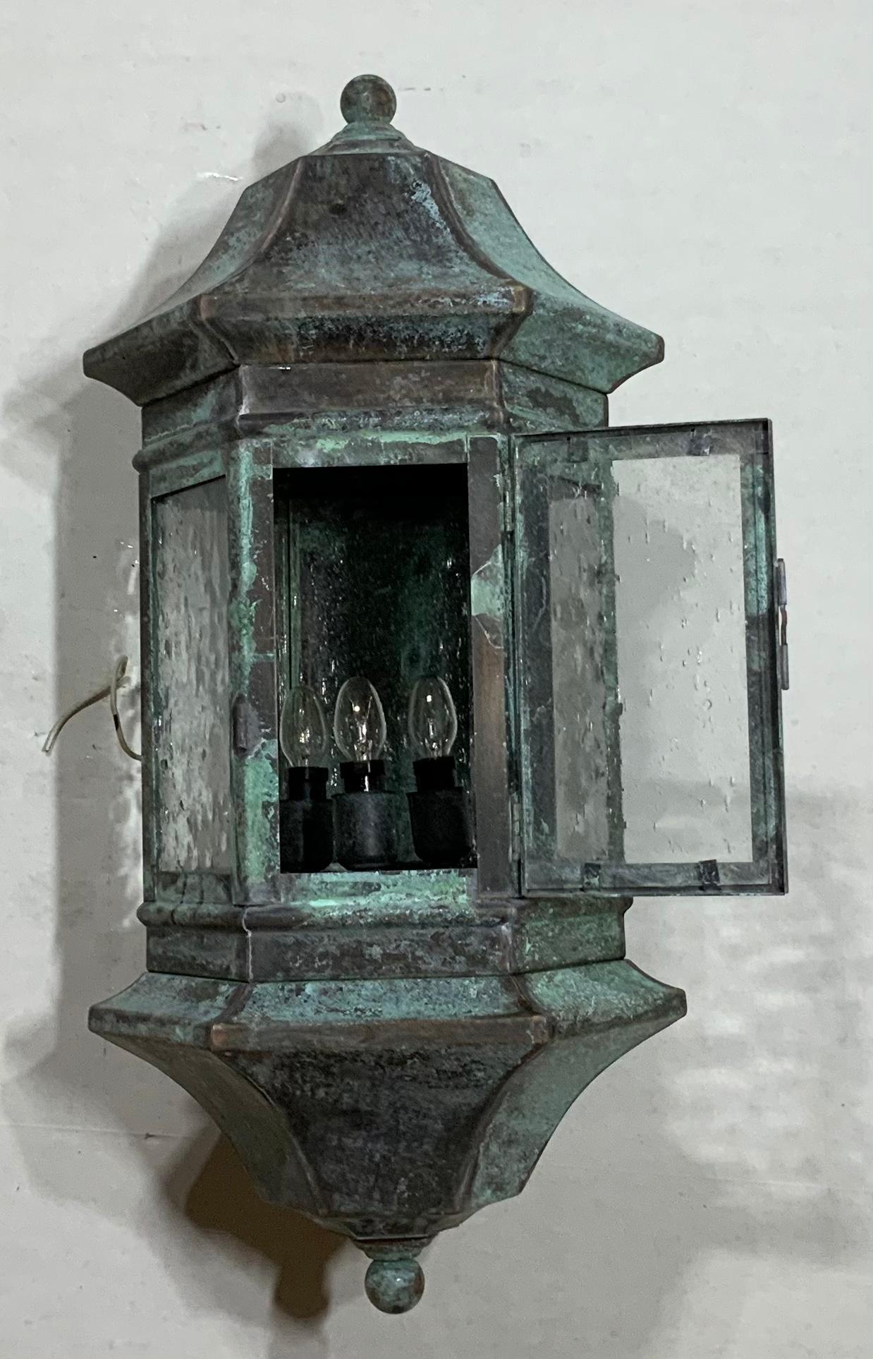 Quality wall lantern handcrafted from solid brass, seeded glass, and three 40/watt lights ,up to code suitable for wet location. It look like it is special quality light and I have only this one.