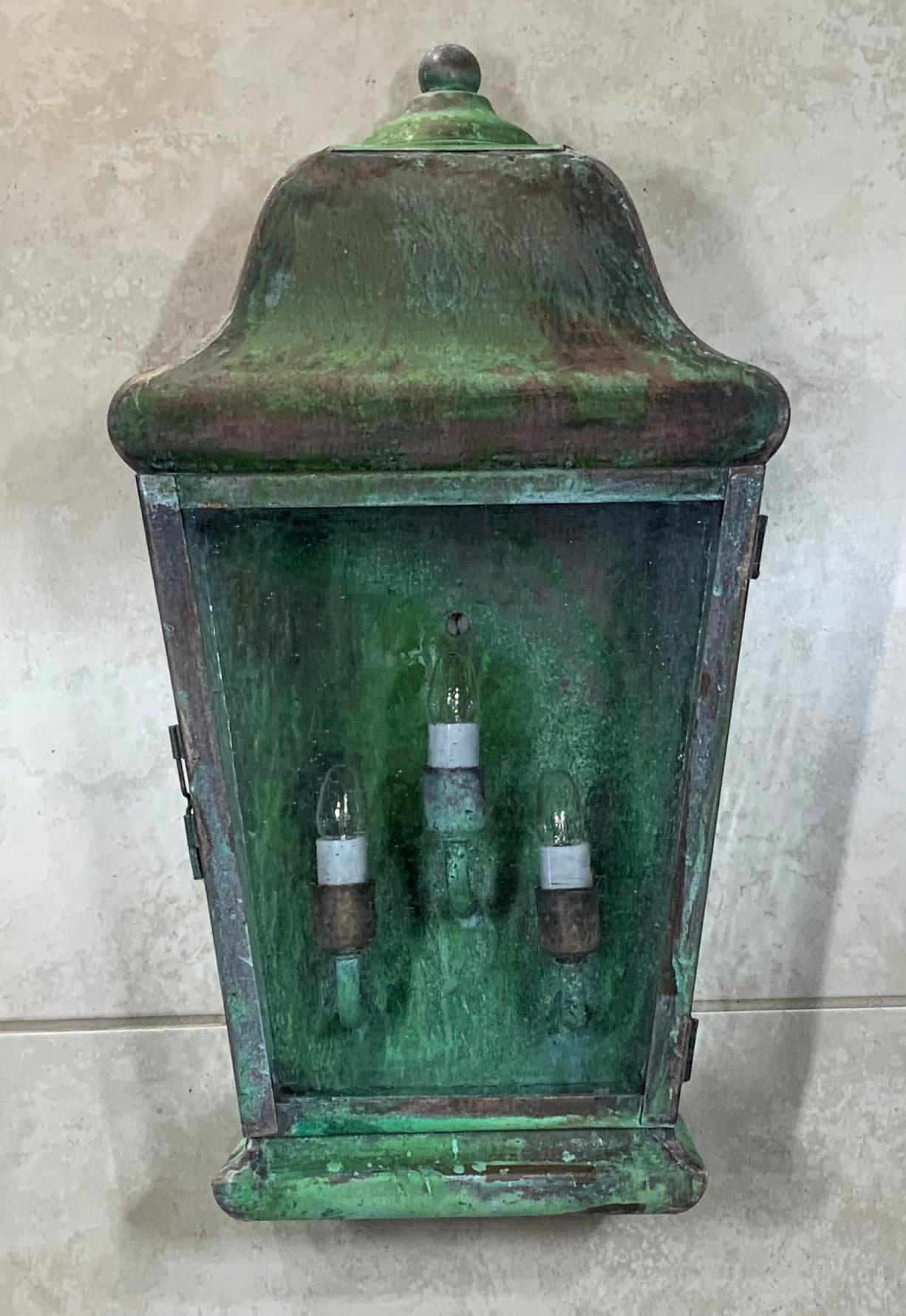 Quality wall lantern made of solid copper, with three/40watt lights, seeded glass, UL approved, suitable for wet location ready for use. Beautiful green oxidization.