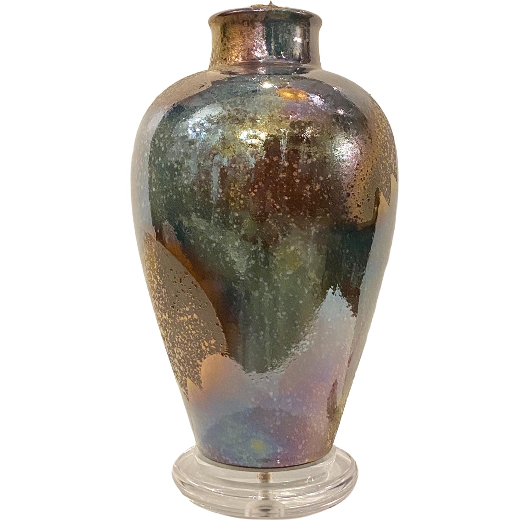 A single circa 1970s American iridescent-glazed ceramic table lamp.

Measurements:
Height of body 20