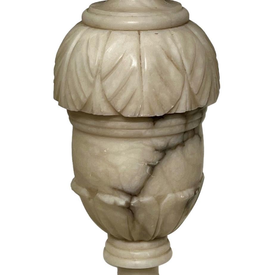 A circa 1950's Italian carved alabaster lamp with pedestal base.

Measurements:
Height of body: 14