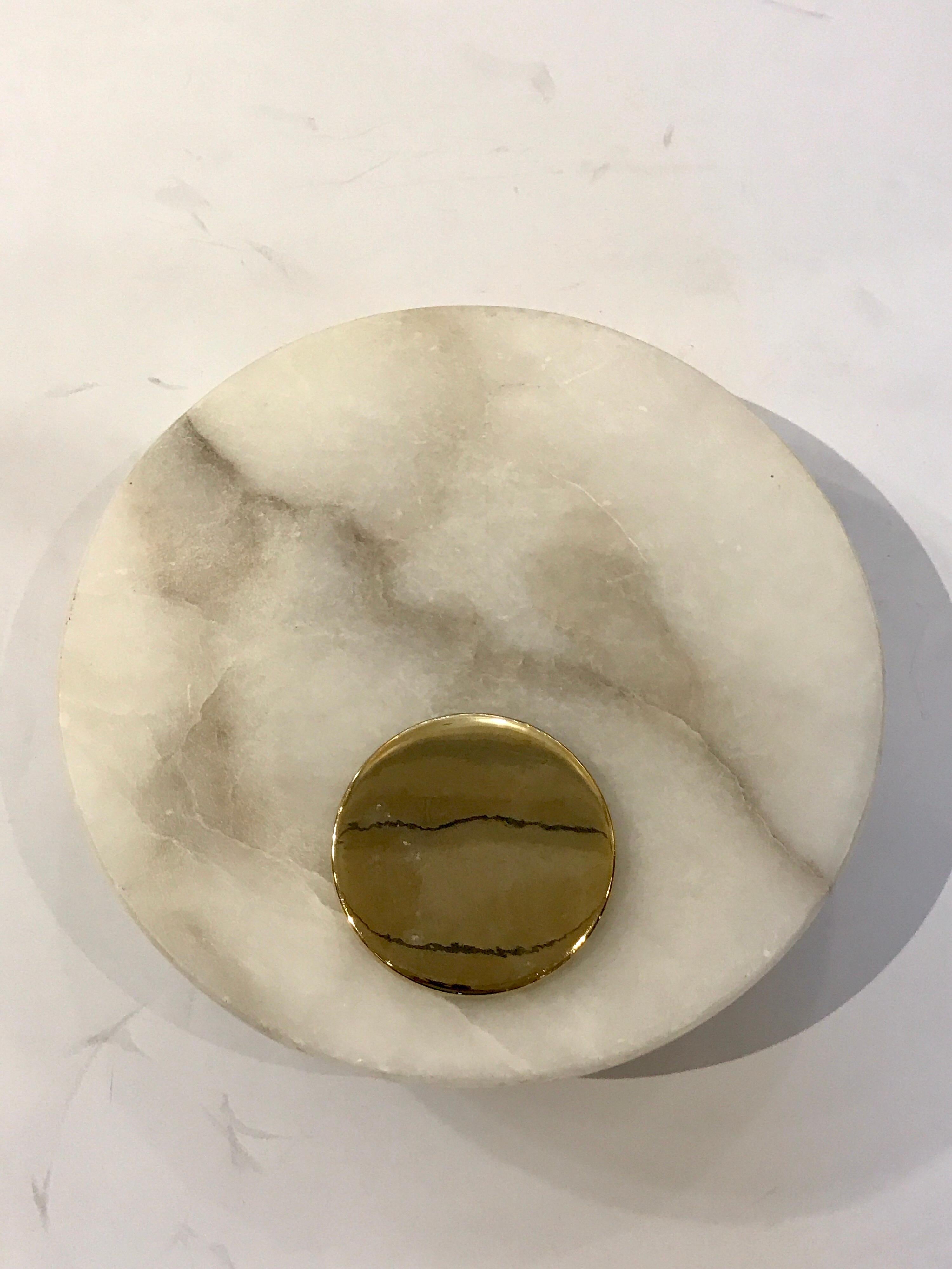 Single Italian circular Carrara marble wall sconce, with a conforming brass mount. 10
