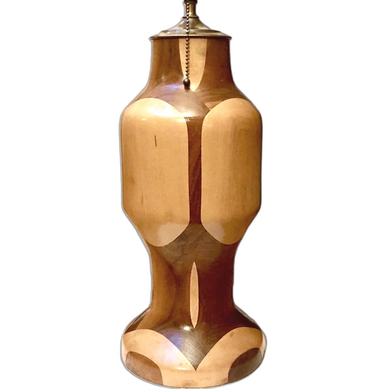 A single circa 1950's Italian two-toned turned wood table lamp.

Measurements:
Height of body: 17