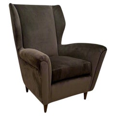 Single Italian Modernist wing chair in the style of Gio Ponti.