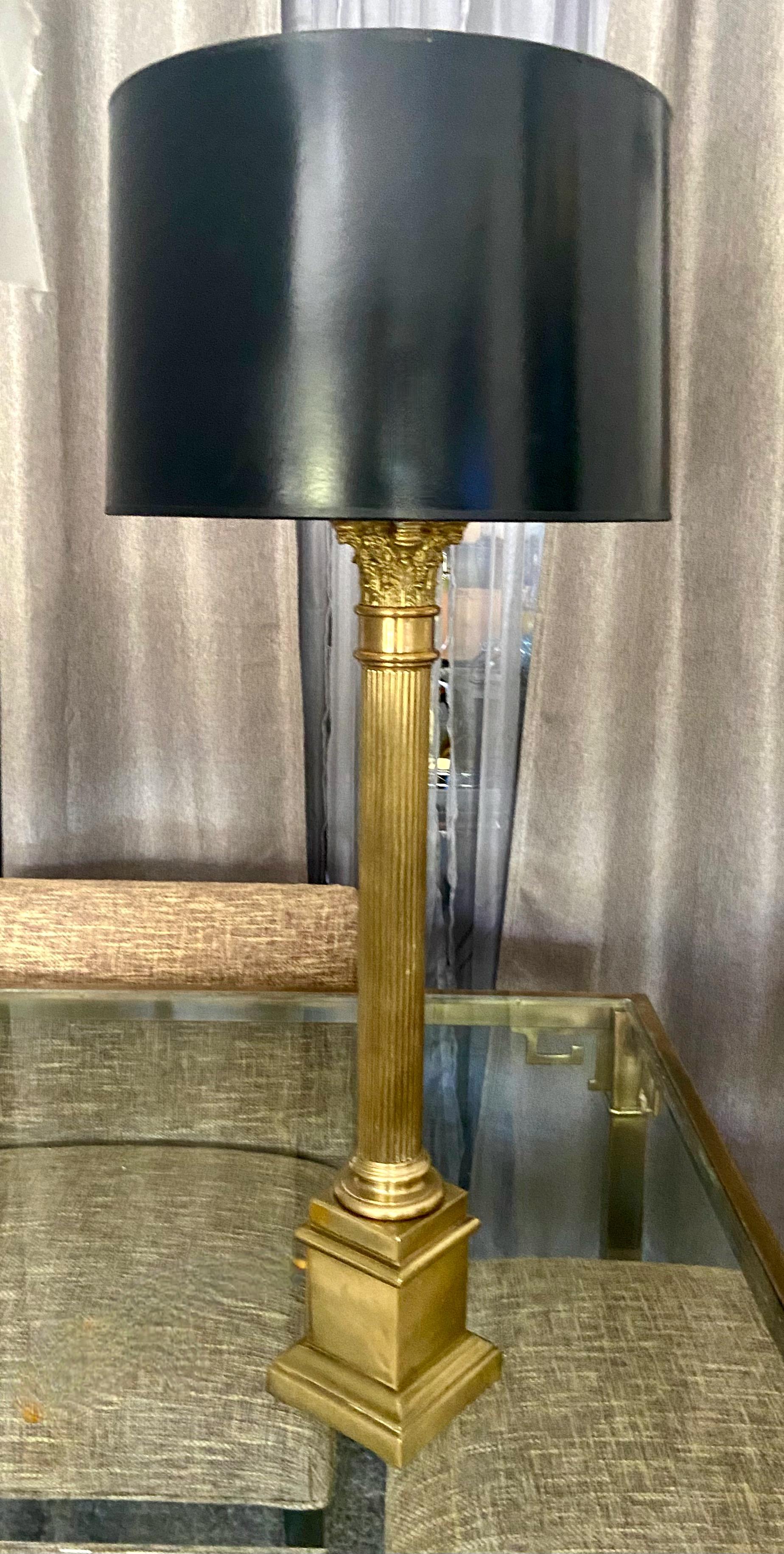 Single tall neo-classical style column form brass table lamp. Has 3 way socket. Shade not included.
 
