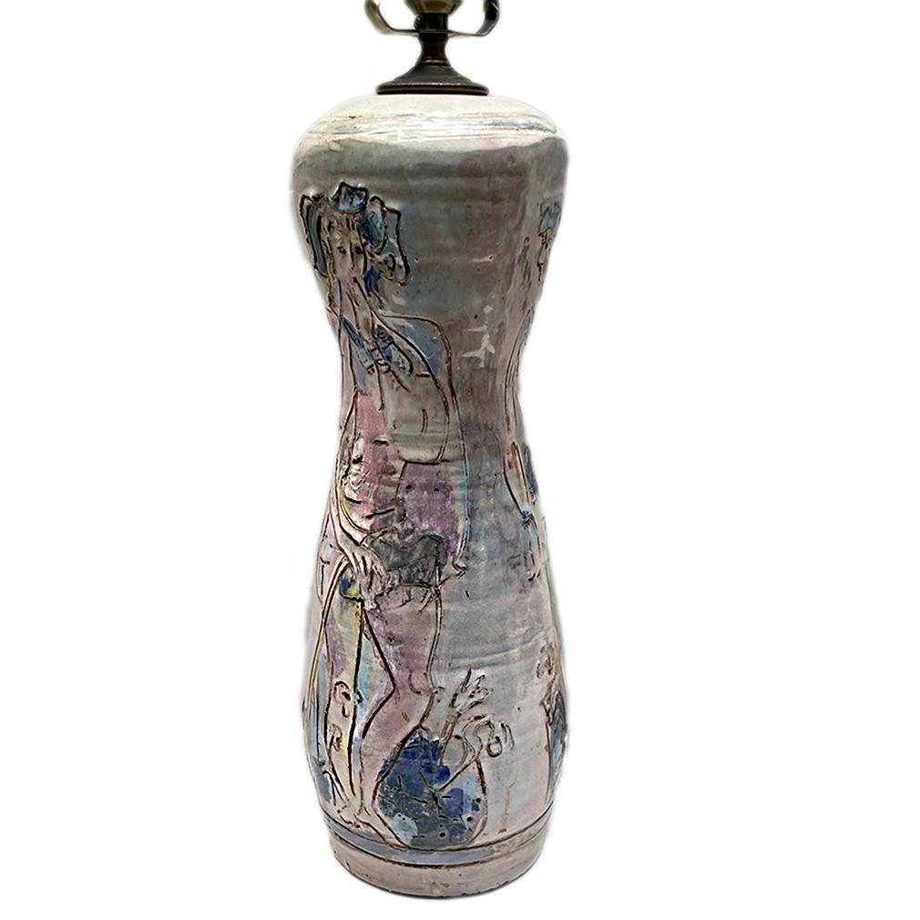 A circa 1960's Italian painted porcelain lamp with figures.

Measurements:
Height of body: 16.75