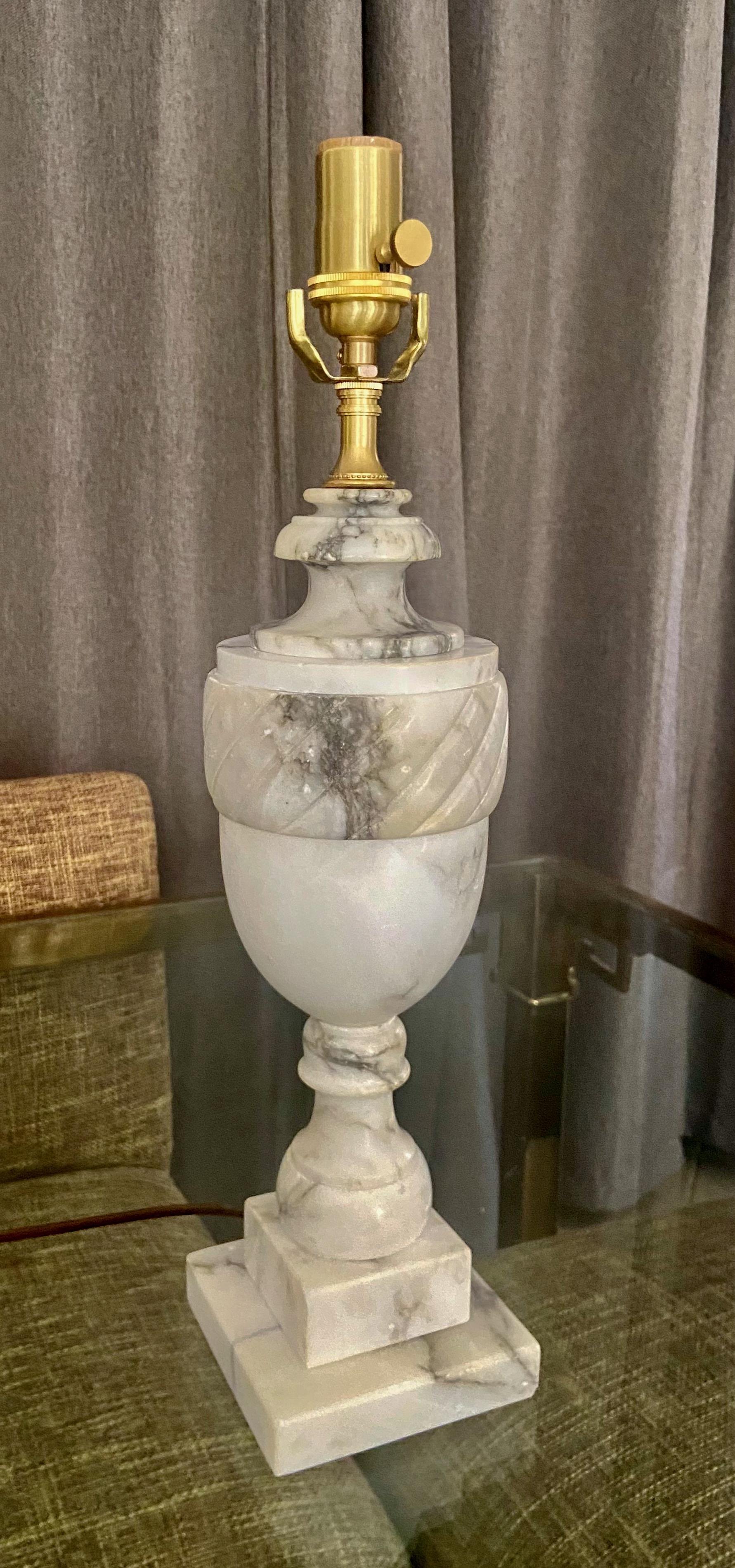 Single finely crafted hand carved neo-classic style urn form alabaster lamp. Newly wired with 3 way socket and rayon covered cord.
Height to top of alabaster is 15.