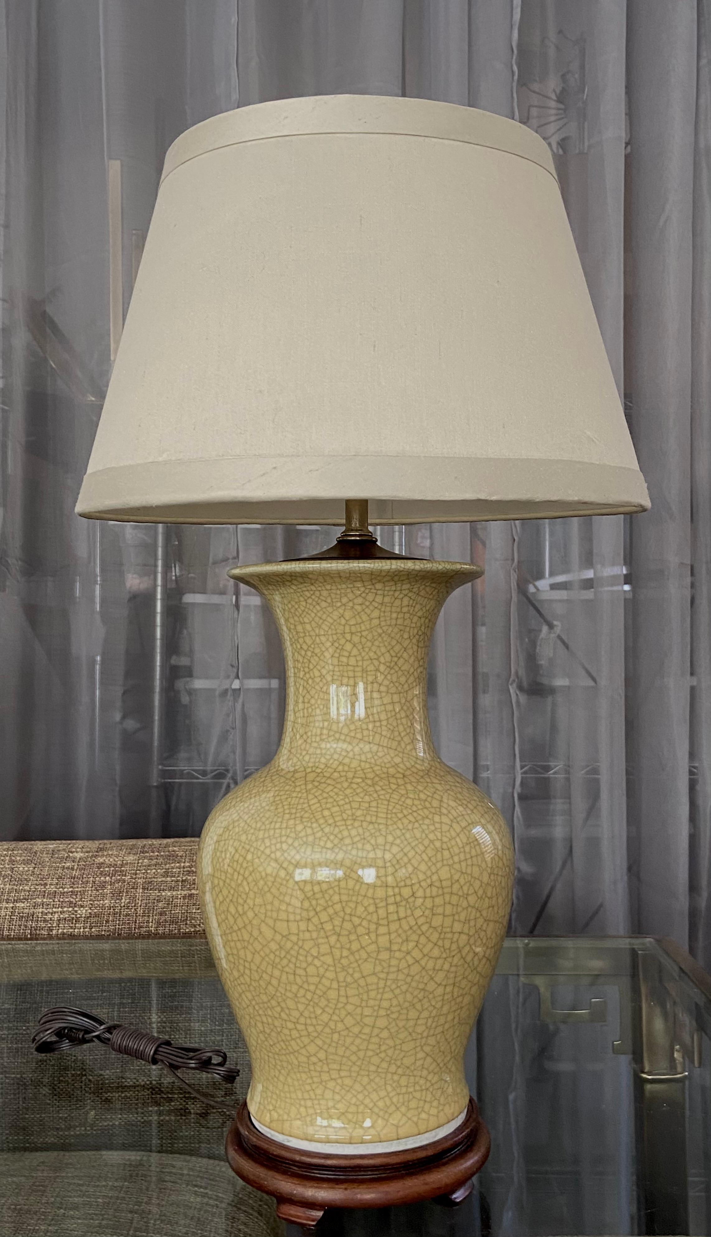 Single Japanese okra yellow crackle finish porcelain vase mounted on Asian style wood turned lamp base. New 3 way socket and wiring. Vase portion is 14
