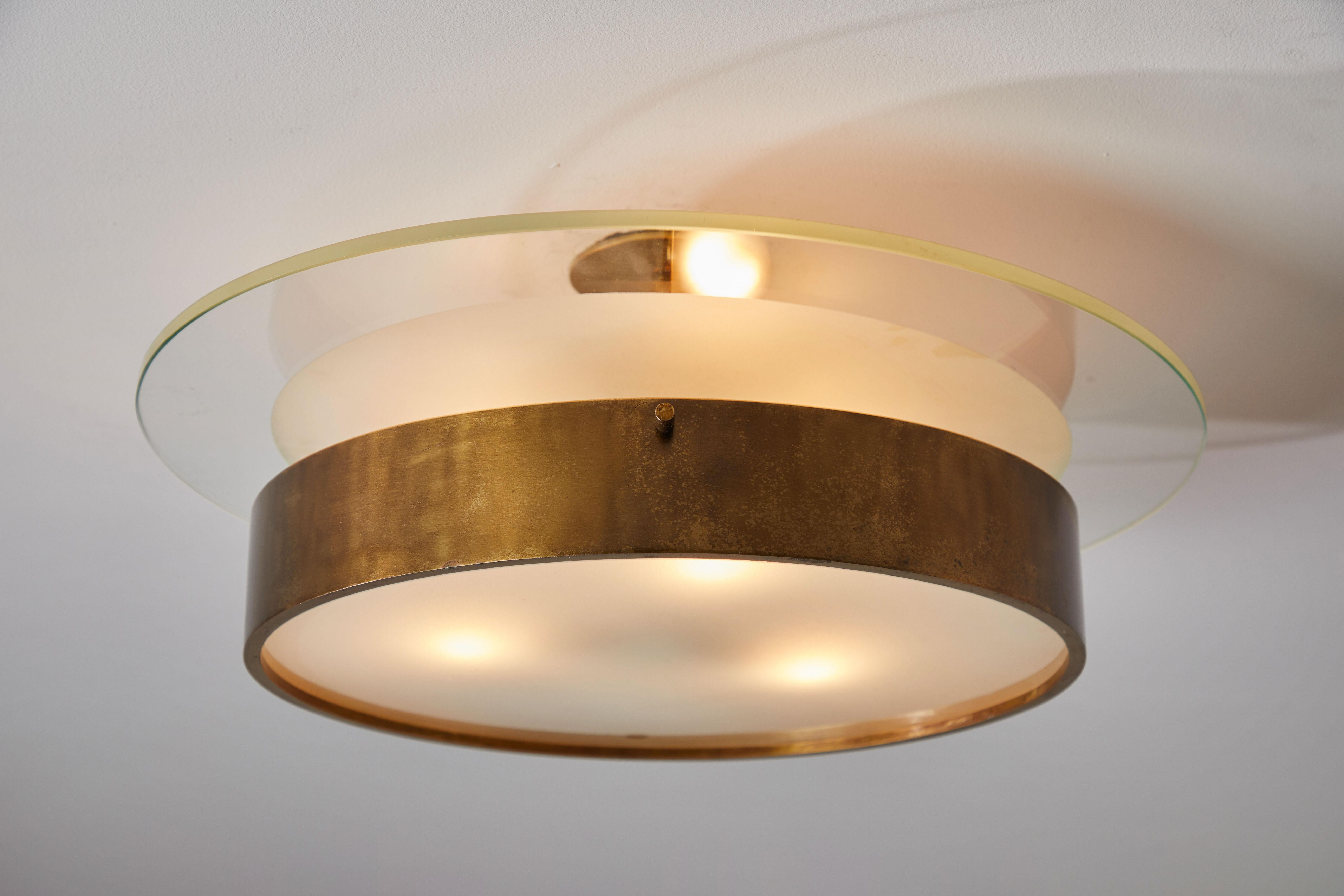 Single large flush mount ceiling light by Stilnovo. Manufactured in Italy, circa 1950s. Lacquered brass, crystal and satin glass diffusers. Rewired for US junction boxes. Light takes three E27 25w maximum bulbs.