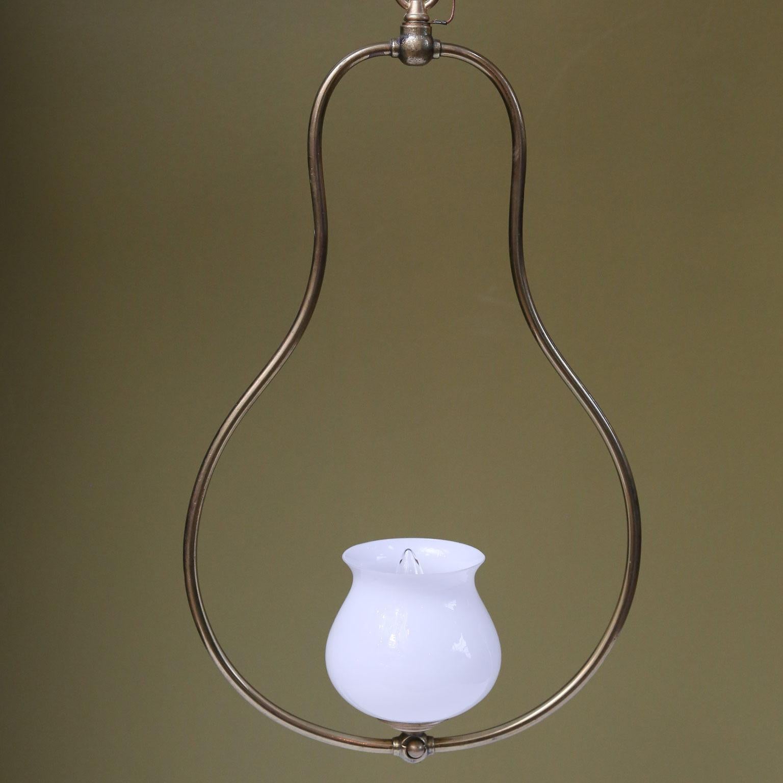 Single light brass hall lantern with milk glass shade. This elegant, simple French light is circa 1920. Newly wired for use within the USA. Includes chain and a canopy. The lights is so simple and pretty.  The light can go in a French Provincial or