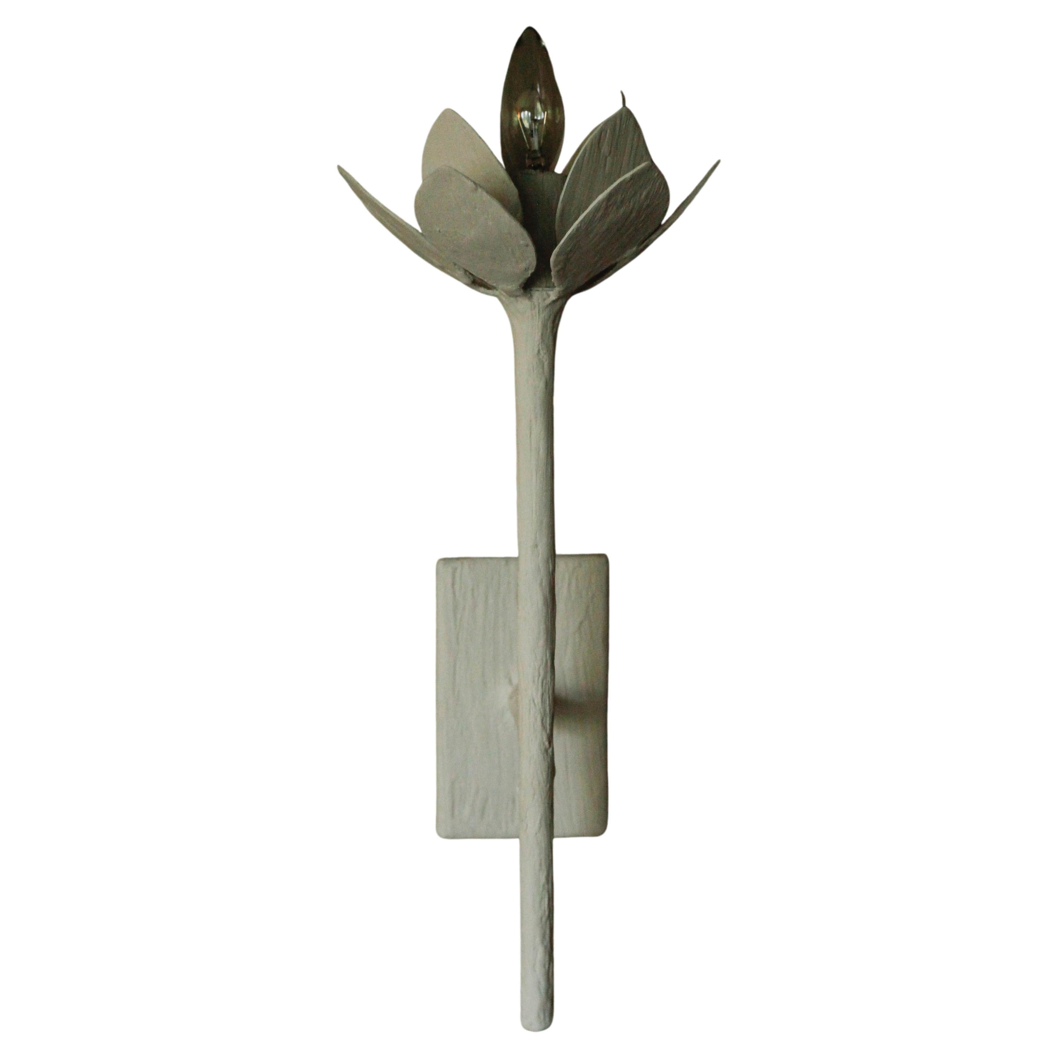 Single elegant lotus flower wall sconce by Tracey Garet of Apsara Interior Design. The fabrication is plaster over steel tubing. The item shown is in white plaster. All Aspara Lighting Designs are custom made. They can be modified to any specific
