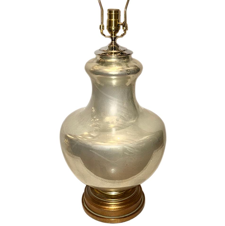A French 1960's mercury glass lamp with gilt base.

Measurements:
Height of body: 19
