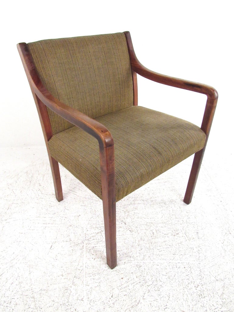 This elegantly simple desk chair features beautiful dark walnut wood and comfortable upholstery. Its simple style will blend effortlessly with any home office. It is extremely comfortable and would function just as well in any sitting room or home