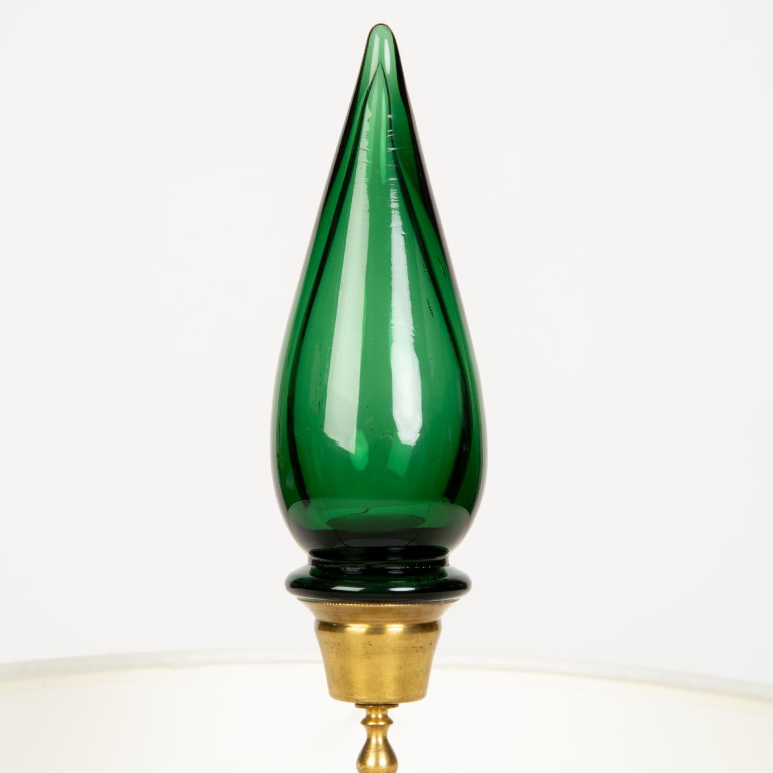 I love this decadent pale green glass lamp with original matching finial with new white shade and original gold
colored metal base.